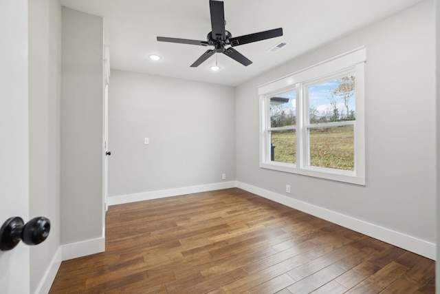 unfurnished room with ceiling fan and wood-type flooring