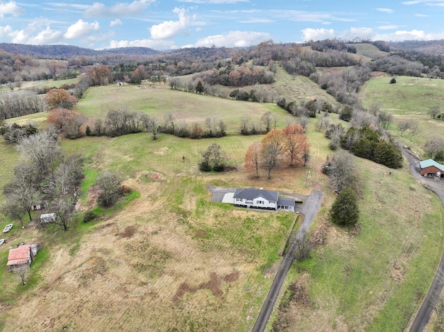 birds eye view of property with a rural view