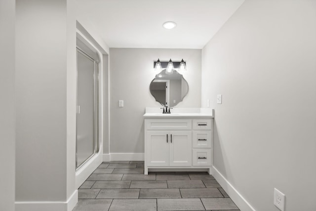 bathroom with vanity and an enclosed shower