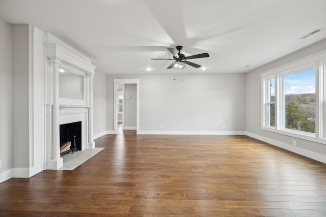 unfurnished living room featuring ceiling fan and wood-type flooring