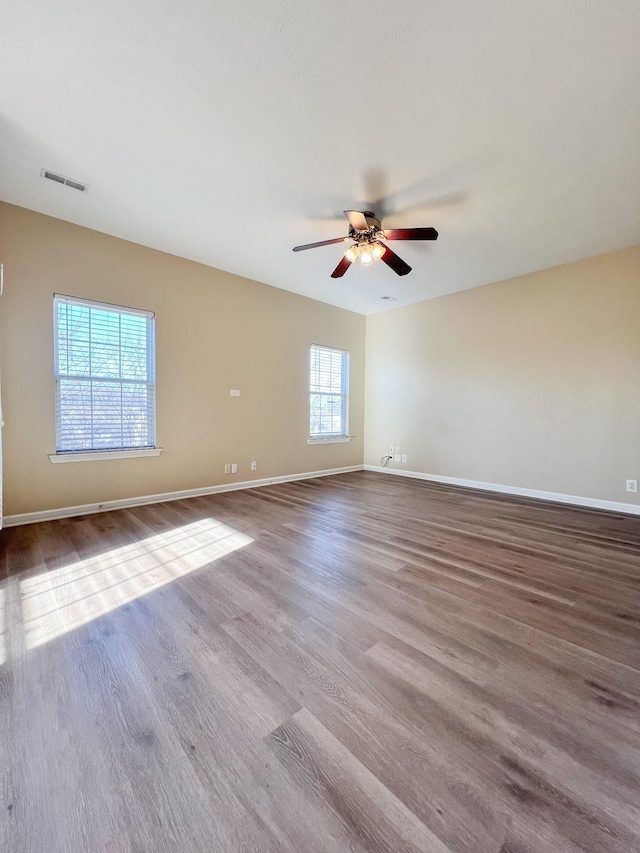 spare room featuring ceiling fan and light hardwood / wood-style floors