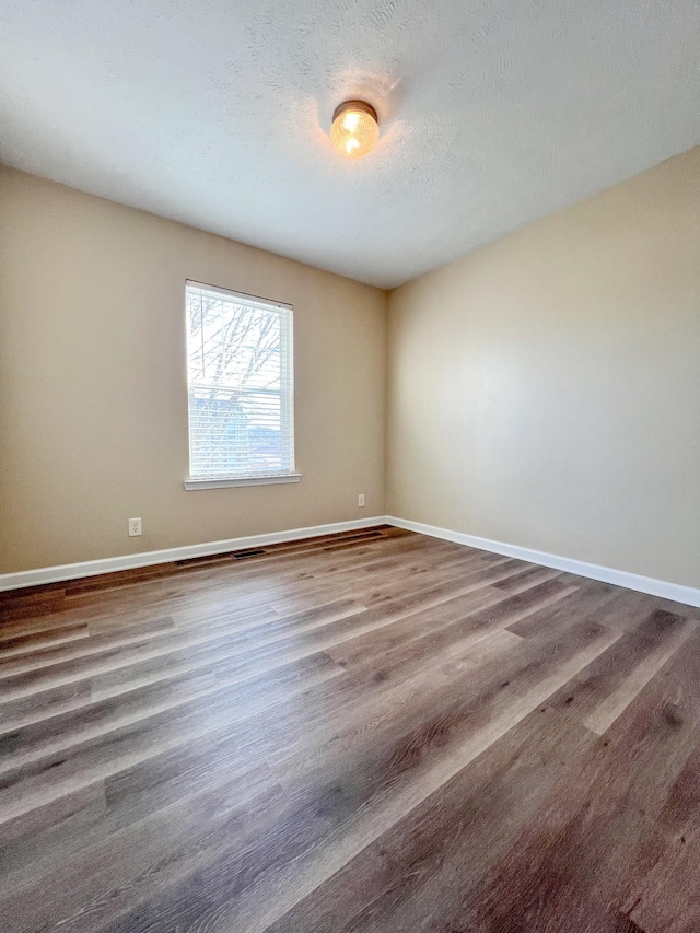 spare room featuring a textured ceiling