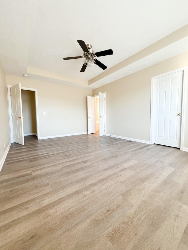 empty room featuring ceiling fan and light wood-type flooring