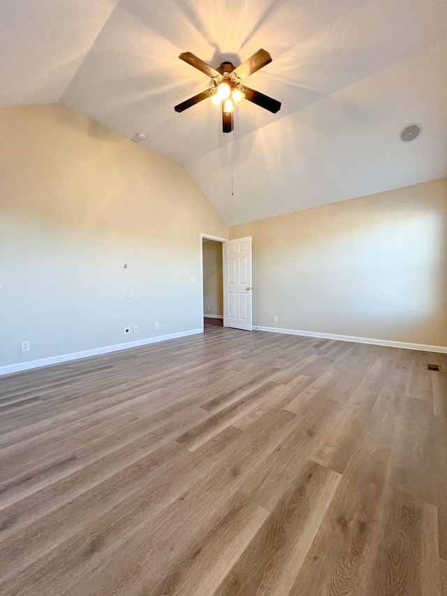 spare room with ceiling fan and vaulted ceiling