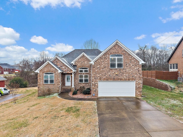 view of front facade with a garage and a front lawn