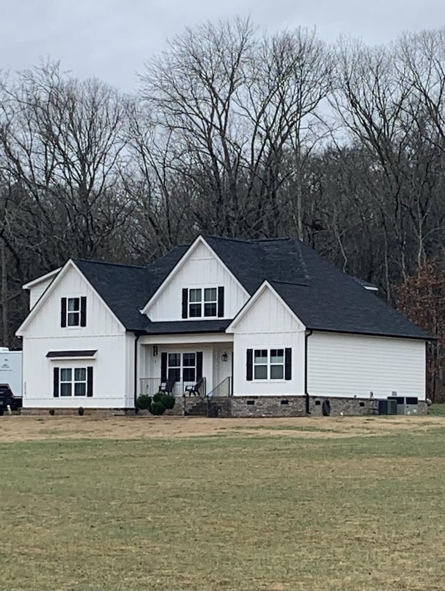 view of front of home with a front lawn and a porch