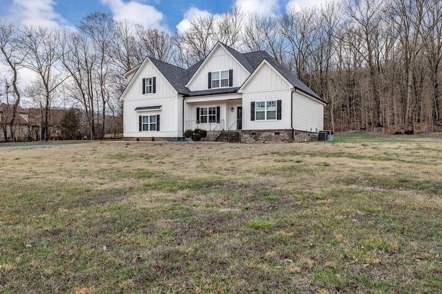 modern farmhouse with a porch, central AC unit, and a front yard