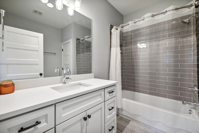 bathroom with vanity and shower / tub combo with curtain