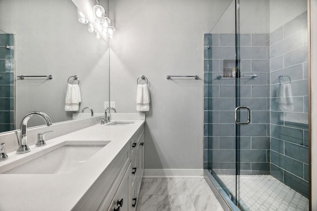 bathroom featuring vanity and an enclosed shower