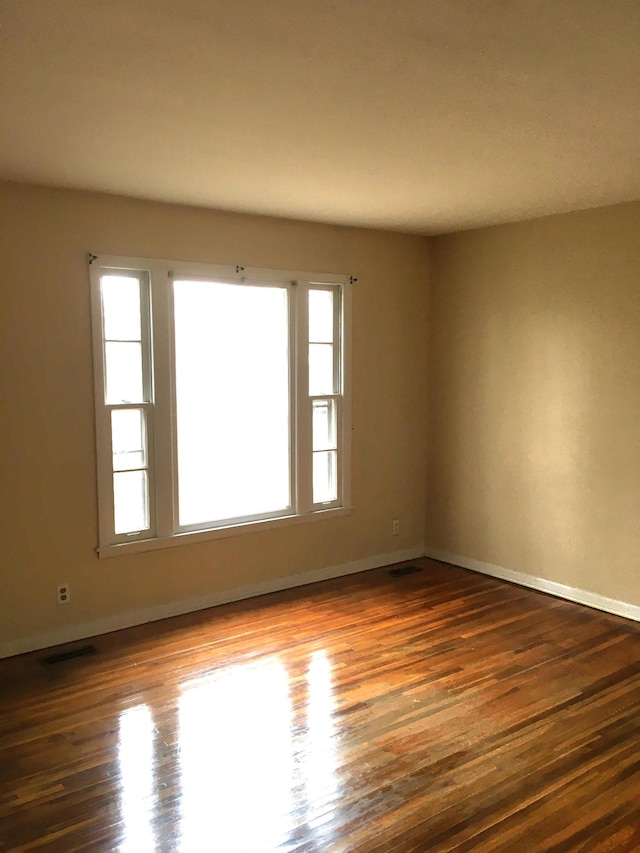 empty room featuring dark hardwood / wood-style floors