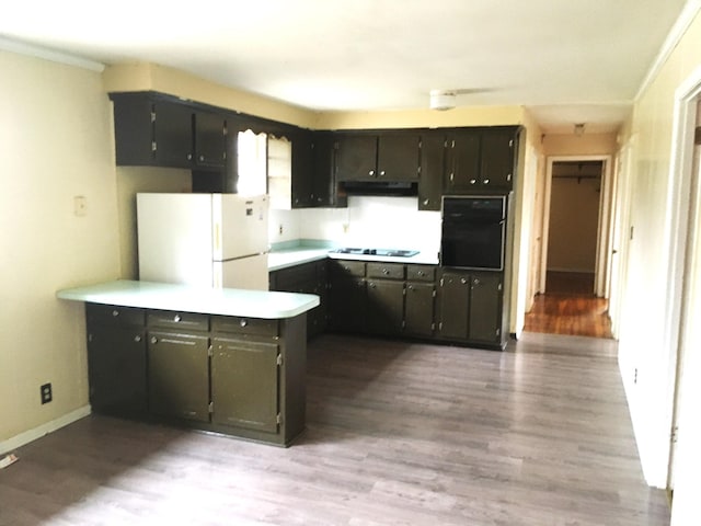 kitchen with crown molding, light hardwood / wood-style flooring, and white appliances