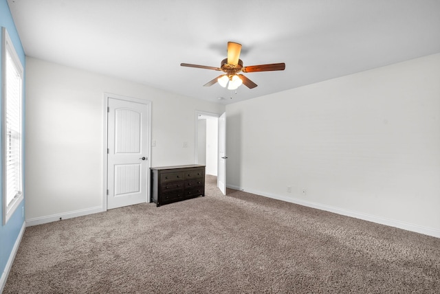 unfurnished bedroom with carpet flooring and ceiling fan