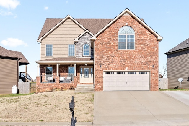 view of front of house featuring a porch and a garage