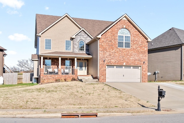 view of front of home with covered porch and a garage