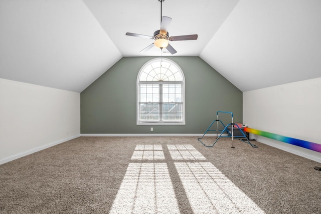 rec room with carpet, ceiling fan, and lofted ceiling