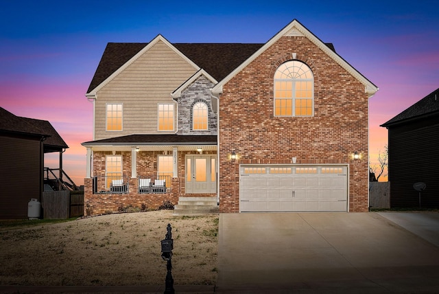 front facade featuring a porch and a garage