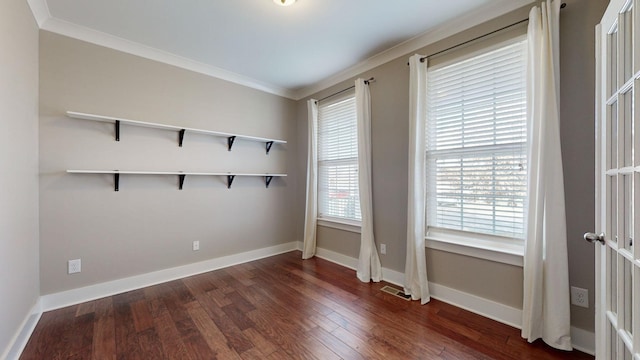 unfurnished room featuring crown molding and dark hardwood / wood-style floors