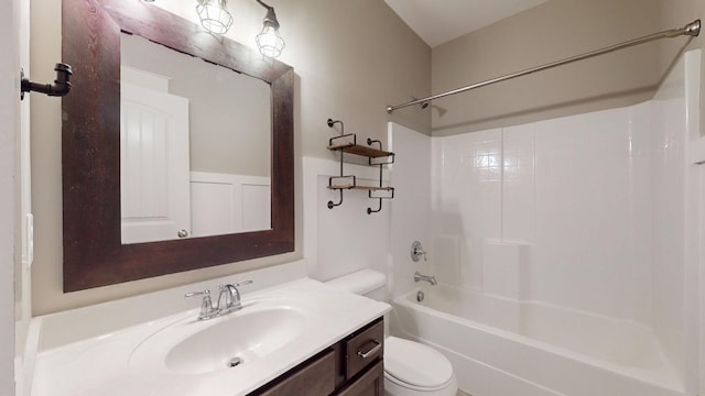 full bathroom featuring bathtub / shower combination, vanity, and toilet