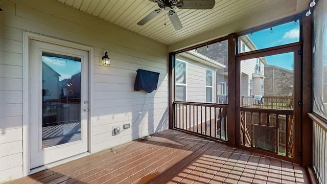 sunroom / solarium with ceiling fan