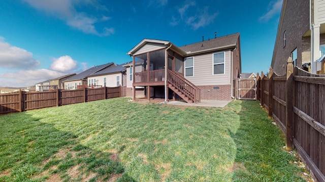 rear view of property featuring a lawn