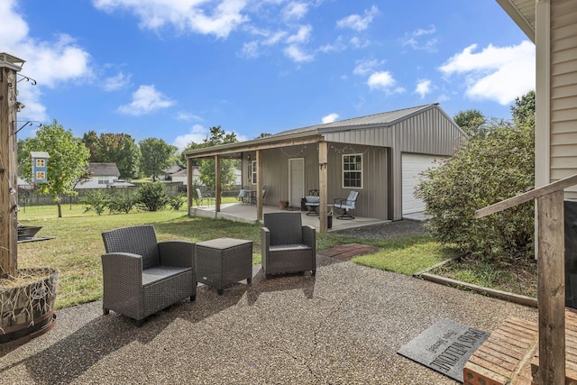 view of patio / terrace with an outdoor structure and a garage