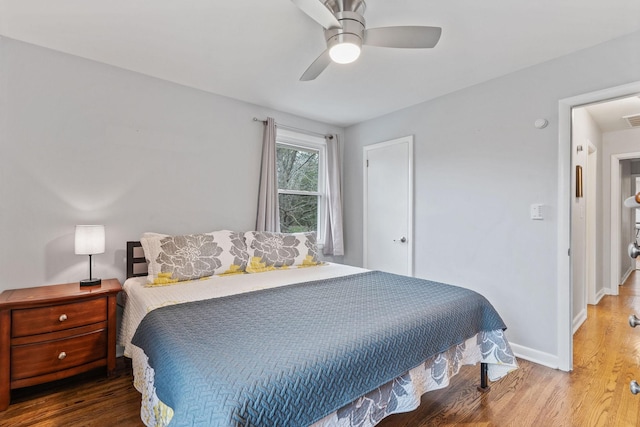 bedroom featuring wood-type flooring and ceiling fan