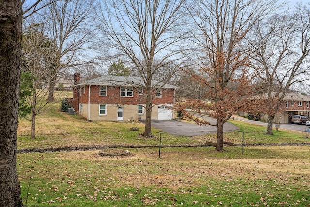 view of front facade with a front yard and a garage