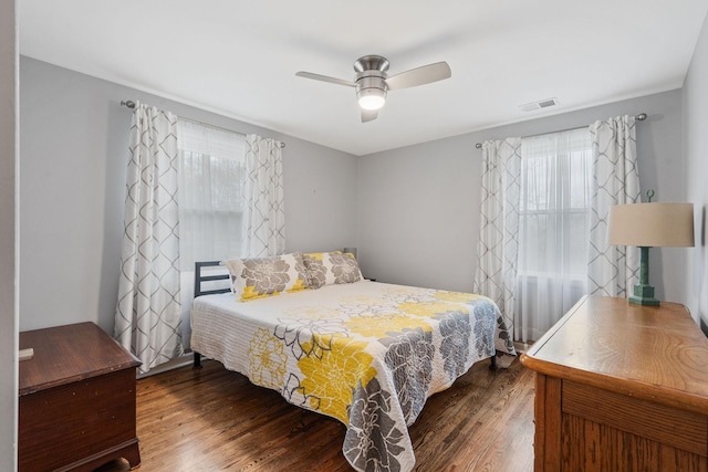 bedroom with ceiling fan and wood-type flooring