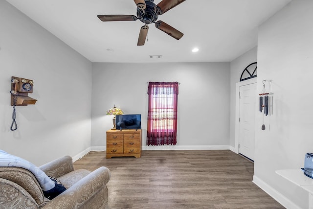 sitting room featuring hardwood / wood-style flooring and ceiling fan