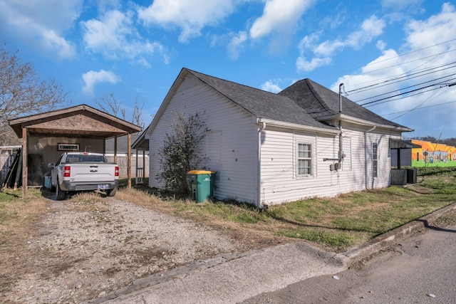 view of home's exterior with a carport