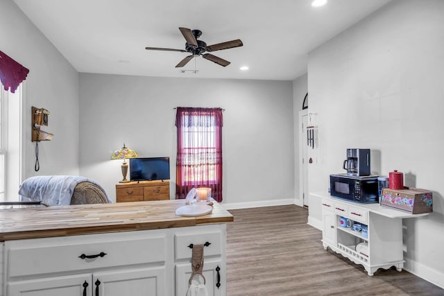 office area with wood-type flooring and ceiling fan