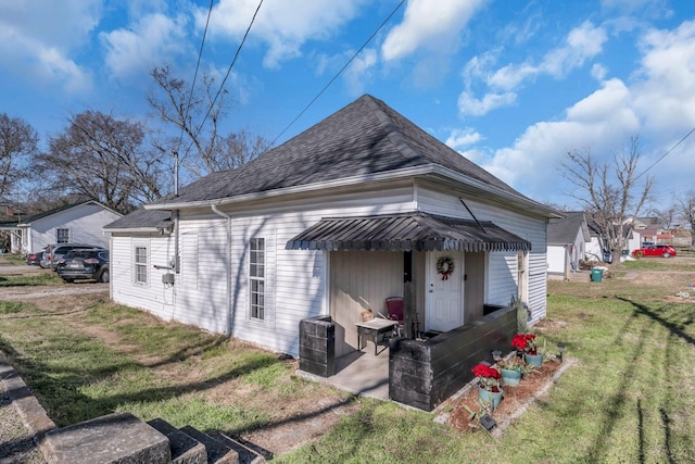 exterior space with a yard and central AC