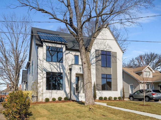 view of front of house with a front lawn