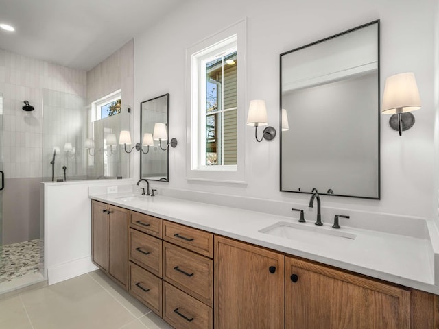 bathroom with vanity, tile patterned floors, and tiled shower