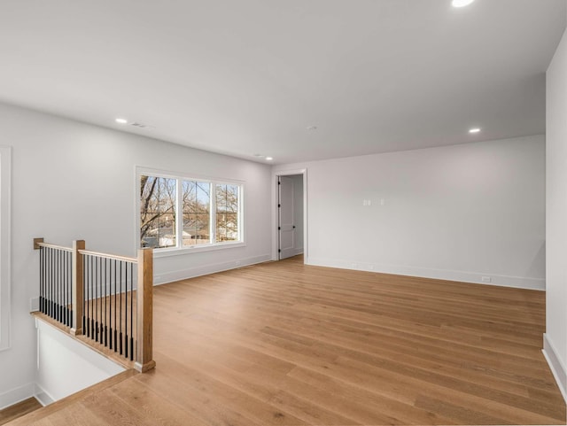 unfurnished room with light hardwood / wood-style floors