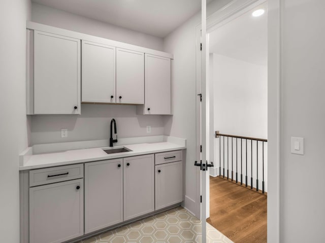 kitchen with light hardwood / wood-style floors and sink