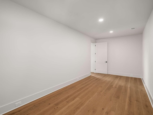 spare room featuring light hardwood / wood-style flooring