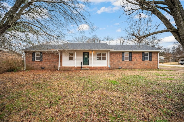 ranch-style home featuring a front yard and a carport