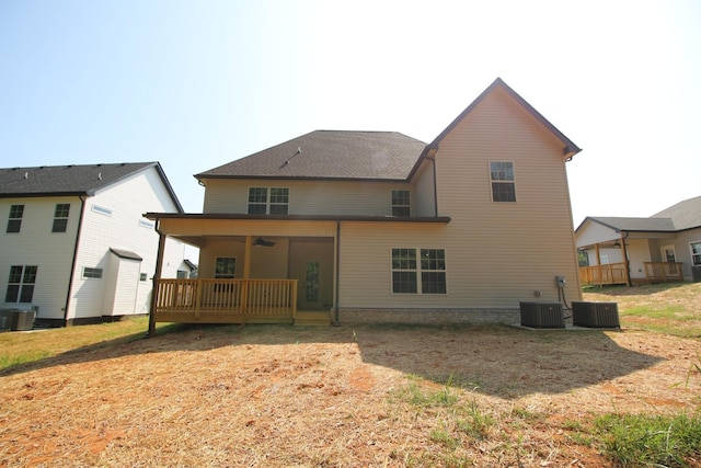 back of house featuring ceiling fan and cooling unit