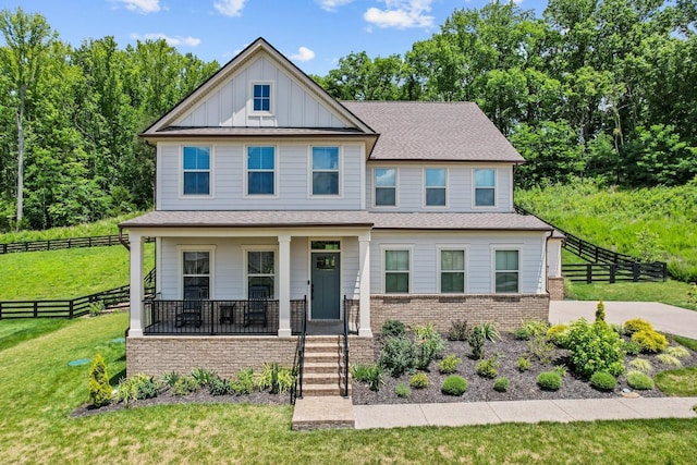 view of front facade with a porch and a front lawn