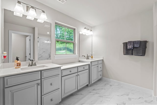 bathroom featuring walk in shower and vanity