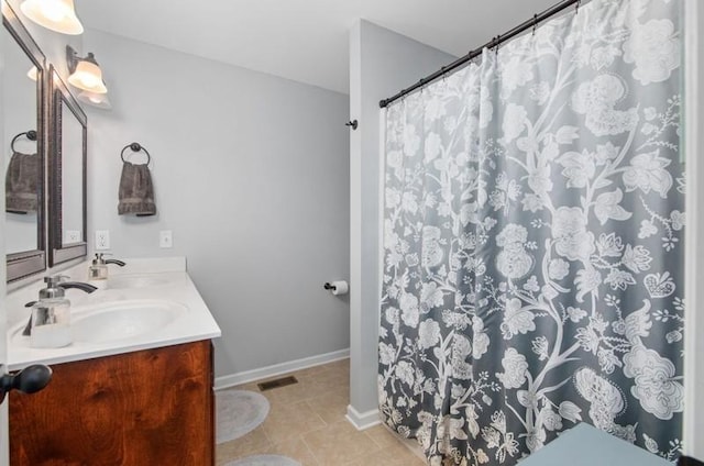 bathroom with tile patterned floors and vanity