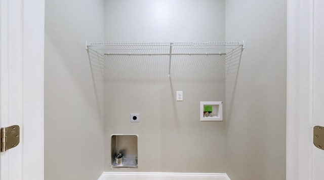 laundry room with washer hookup and electric dryer hookup