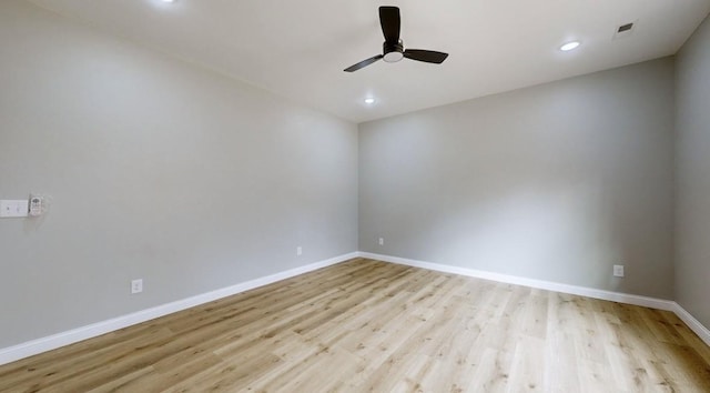 unfurnished room with light hardwood / wood-style flooring and ceiling fan