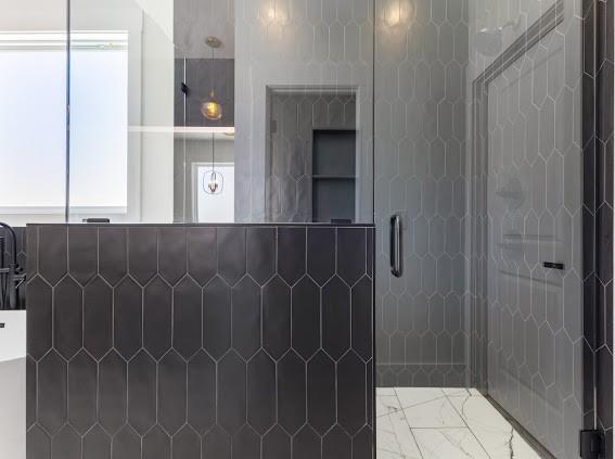 bathroom with a shower stall