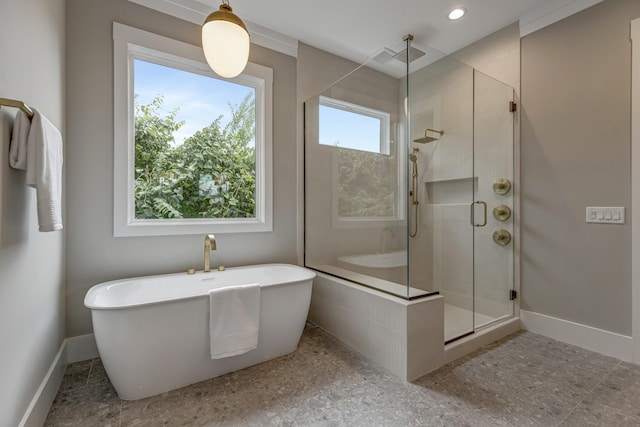 bathroom with shower with separate bathtub