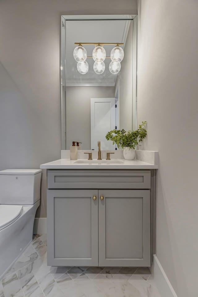 bathroom featuring toilet and vanity