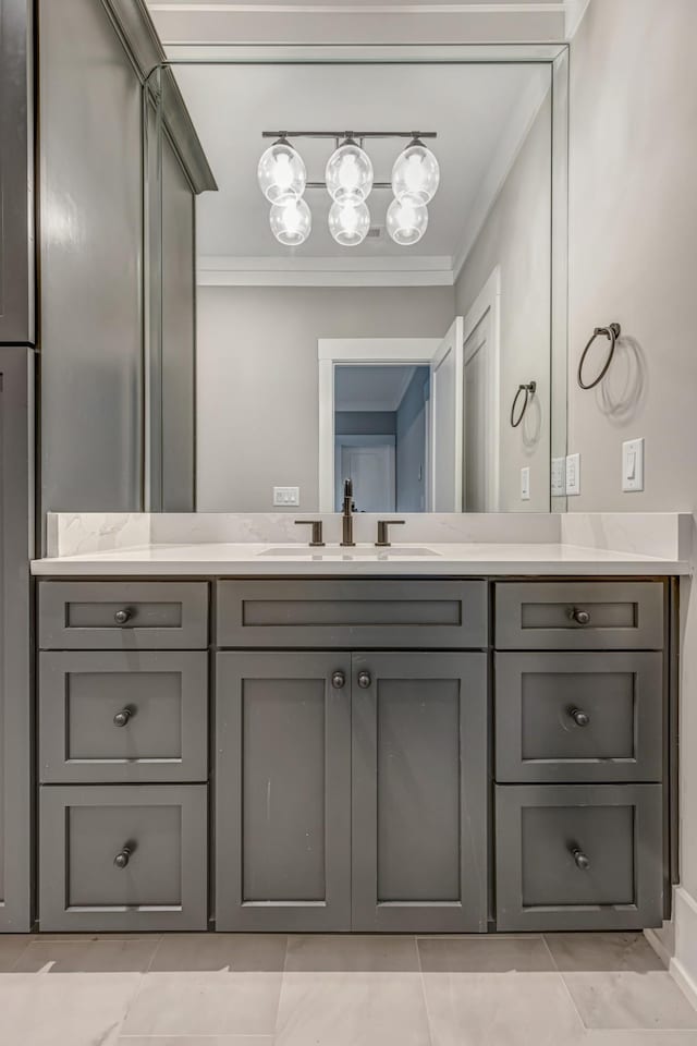 bathroom featuring tile patterned floors, vanity, and crown molding