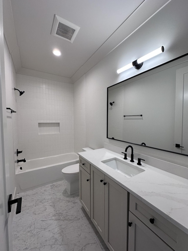 full bathroom with toilet, tiled shower / bath combo, and vanity