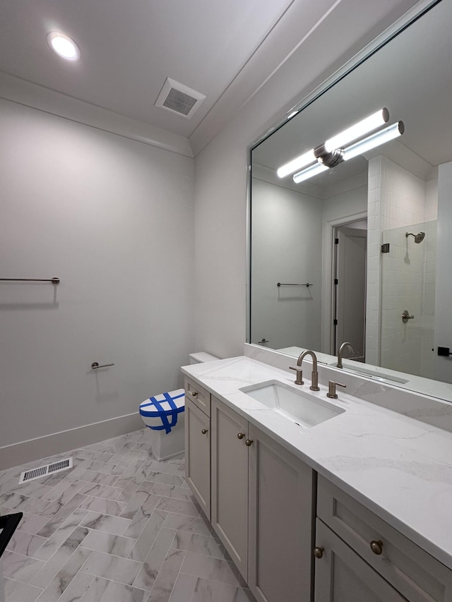 bathroom featuring toilet, crown molding, a shower with shower door, and vanity